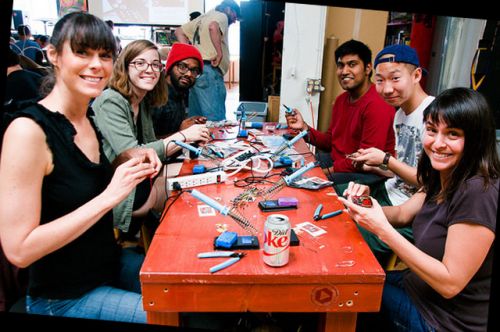 Table with people soldering